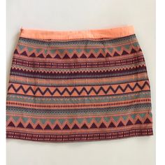 Andre Peach Multicolored Mini Skirt Size Medium Colors: Peach, Blue And Purple Zips On The Side In Good Condition Length 29 In Waist 14 In Summer Patterned Mini Skirt, Trendy Multicolor Mini Skirt For Vacation, Multicolor Stretch Skort For Vacation, Stretch Multicolor Skort For Vacation, Multicolor Mini Skirt With Lined Skirt For Day Out, Multicolor Lined Mini Skirt For Day Out, Multicolor Mini Skort For Day Out, Bohemian Multicolor Mini Skirt For Day Out, Beach Skort In Multicolor With Lined Skirt