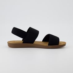 Meet Gabi, a linen flat sandal. These chic and comfortable sandals feature a soft stretch fabric upper and easy on-off slip fit for all day wear. Memory foam padding and a non-slip traction outsole ensure you feel comfy and supported. Add a little sophistication to your wardrobe with Gabi Stretch Linen Sandals. Black Slip-on Sandals With Adjustable Strap, Adjustable Cushioned Slingback Slip-on Sandals, Adjustable Slingback Synthetic Footbed Sandals, Adjustable Synthetic Slingback Footbed Sandals, Black Flat Sandals With Adjustable Straps, Spring Strappy Slingback Sandals With Arch Support, Synthetic Slingback Sandals For Vacation, Black Synthetic Footbed Sandals With Adjustable Straps, Vacation Synthetic Slingback Sandals