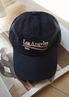 Our embroidered Los Angeles baseball hat is the perfect accessory for the girl on the go that is running errands, going on a hike or just wants to complete the outfit with the perfect accessory. One Size fits all with adjustable strap. Color: Navy All accessories are Final Sale - No Returns No Exchanges. Summer Baseball Cap With Letter Print For Outdoor, Casual Trucker Hat For Baseball Season And Outdoor Activities, Adjustable Navy Embroidered Hat, Adjustable Travel Hat With Curved Visor, Adjustable Curved Visor Hat For Travel, Retro Adjustable Dad Hat With Embroidered Logo, Travel Baseball Cap With Letter Print, Casual Travel Baseball Cap With Visor, Navy Adjustable Hat For Travel