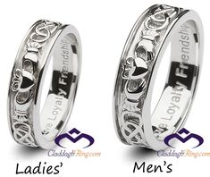 two wedding rings with names engraved on them