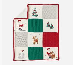 a blanket with santa and reindeers on it