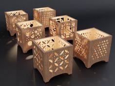 six wooden boxes with laser cut designs on them