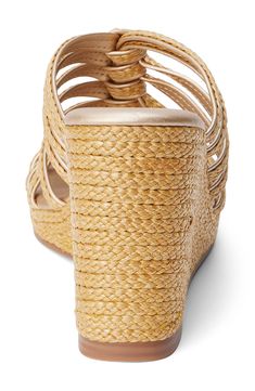 Braided raffia straps weave into one another on this stunning wedge sandal that'll have you ready to hit the cabana in style. 3 3/4" heel; 3/4" platform Textile upper/synthetic lining and sole Imported Natural Straw Heels For Beach Season, Straw Wedge Heel Sandals For Beach Season, Straw Wedge Sandals For Beach Season, Elegant Straw Platform Wedge Sandals, Adjustable Straw Heels For Vacation, Straw Wedge Sandals For Vacation, Elegant Adjustable Wedge Sandals For Vacation, Elegant Wedge Sandals For Beach Season Vacation, Vacation High Heel Heels With Braided Straps