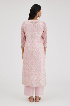 Pink, off-white straight long kurta with ikat hand block print and thread, mirror embroidered sleeve hem. Paired with cotton slip, stripe print pant and dupatta with gota work.
Components: 4
Pattern: Hand Block Print, Embroidery
Type Of Work: Ikat, diagonal stripe, thread, mirror, gota
Neckline: Notched
Sleeve Type: Three quarter
Fabric: Kurta and Dupatta: Cotton Chanderi, Slip and Pant: Cotton
Color: Pink,Off White
Other Details: 
Tassel bordered sheer dupatta
Lace embroidered hem
Elasticated b Dupatta Lace, Kurta And Dupatta, Sheer Dupatta, Saree Jackets, Pink Kurta, Long Kurta, Embroidered Hem, Print Pant, Simple Kurti Designs