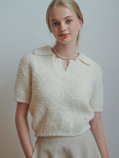 This product is a chic pear open collar knit top, offering a blend of casual elegance and comfort. The top features a delicate collar detail and short sleeves, making it a versatile piece for various occasions. Its textured knit fabric adds a touch of sophistication to the overall design. The open collar of this knit top adds a refined touch, making it suitable for both casual and smart-casual looks.Short sleeves contribute to the top's lightweight feel, perfect for transitional weather or Chic V-neck Knit Top With Seamless Collar, Cream Textured Knit Top With Short Sleeves, Elegant Collared Textured Knit Tops, Short Sleeve Knit Top With Seamless Collar, Knit Short Sleeve Top With Seamless Collar, Chic Beige Short Sleeve Knit Top, Elegant Collared Knit Top, Textured Knit, Casual Elegance