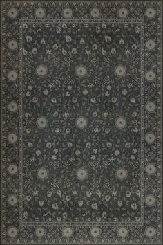 an area rug with black and white flowers