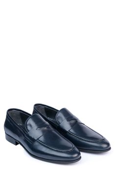 Handmade of smooth leather, this moc-toe dress shoe with a classic penny loafer silhouette offers a sophisticated, elegant look. Leather upper and lining/synthetic sole Made in Turkey Blue Slip-on Formal Loafers, Classic Blue Slip-ons For Business, Classic Blue Wingtip Loafers, Classic Blue Oxfords For Formal Occasions, Blue Classic Plain Toe Moccasins, Elegant Blue Loafers For Formal Occasion, Classic Blue Semi-formal Dress Shoes, Classic Blue Dress Shoes For Semi-formal Occasions, Elegant Blue Formal Loafers