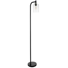 a black floor lamp with a glass shade