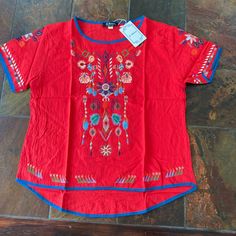 Bright Red Embroidered Top With Short Sleeves, High-Low, New With Tags. It’s 65% Cotton, 35% Polyester, Machine Wash Separately. It’s A Large But Looks Like It Runs Small, Like A Large For A Junior. Retro Tops, Embroidered Shorts, Embroidered Top, Short Sleeve Top, Bright Red, High Low, Short Sleeves Tops, Red And Blue, Sleeve Top