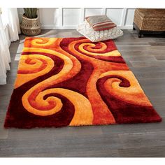 a red and orange rug with swirls on it