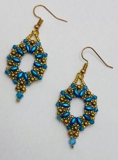 These elegant earrings are handmade and feature gold and teal bead with a little teal drop. Elegant Turquoise Beaded Earrings With Gold Beads, Gold Teardrop Earrings With Spacer Beads, Elegant Turquoise Earrings With Gold Beads, Blue Earrings With Gold Beads, Elegant Gold Beaded Earrings With Spacer Beads, Earring Ideas, Teal And Gold, Gold Drop Earrings, Elegant Earrings