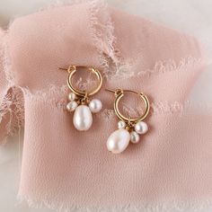 Introducing the Verona Pearl Hoops: handcrafted stunners that'll make you look and feel like a goddess! Perfect for elevating any outfit, these delicate and oh-so-lovely hoop earrings feature a cluster of freshwater pearls that will bring a little luxe to your look. So, take a pearly dive in and show off your style! Make it a set with our matching Verona Pearl Necklace. Handcrafted to order in our Salt Lake City studio ✨ DETAILS Made with freshwater pearls. Available in 14k Gold Filled or Sterli Bohemian Hoop Earrings For Celebrations, Handmade Small Hoop Earrings For Wedding, Handmade Small Hoop Pearl Earrings, Delicate Handmade Bridal Earrings, Handmade Small Hoop Pearl Earrings For Wedding, Handmade Dangle Bridal Earrings, Small Hoop Pearl Earrings For Anniversary, Teardrop Bridal Earrings For Celebrations, Celebration Teardrop Hoop Earrings