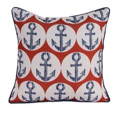 an orange and blue pillow with anchors on it