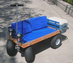 a blue and white cart sitting on the side of a road