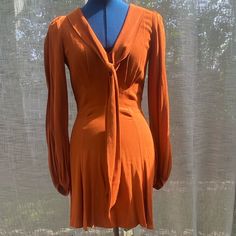 Good Condition- Some Pull In Bust Seams In Photos Measured Flat: Size 4 Pit To Pit: 16” Waist: 14” Hip: 20.5” Shoulder To Hem: 33” Sleeve: 25” Sailor Bow, Orange Baby, Reformation Dress, Bow Dress, Reformation Dresses, Brown Orange, Dress With Bow, Baby Doll, Burnt Orange