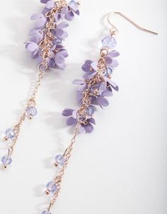 Flower power! These lovely lilac drops will draw all eyes to you! They boast an impressive drop and pretty petal details on a gold-toned setting. Pair them with gold-toned accessories for a glam look, or layer them with pastel tones.  Product Details:    Composition: Gold-toned metal earrings with plastic beads.  Colour: Lilac and gold Style: Pastel Dreaming Occasion: Out for breakfast, lunch or dinner? These versatile beauties suit all three!  Care: Avoid direct contact with water, moisturiser Lovisa Jewellery, Fashion Jewellery Online, Flower Cluster, Glam Look, Bold Earrings, Glam Looks, All Eyes, Moon Earrings, Stunning Earrings