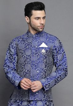 Art Silk Nehru Jacket in Royal Blue. This Readymade Sleeveless attire is Enhanced with Block Print and Resham Work. Crafted in Chinese Collar Neck. Do note: Brooch and Kurta shown in the image is for presentation purposes only. Half to one inch may vary in measurement. (Slight variation in actual color vs. image is possible). We sell all kinds of menswear. Mens Kurta | Mens Kurta Pajama | Mens Sherwani | Mens Sherwani Sets | Traditional Menswear | Partywear Menswear | Indian Mens Dresses | Diwal Fitted Blue Nehru Jacket For Designer Wear, Fitted Blue Nehru Jacket For Designer Events, Blue Sleeveless Kurta For Festive Occasions, Fitted Blue Outerwear For Designer Wear, Blue Fitted Outerwear For Designer Wear, Festive Sleeveless Blue Kurta, Festive Blue Sleeveless Kurta, Blue Embroidered Nehru Jacket For Wedding, Festive Blue Designer Nehru Jacket