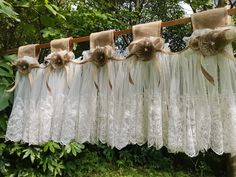 lace and burlock sashes are hung on a clothes line