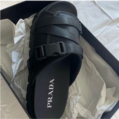 Brand New Black Prada Sandals Men’s 10 Luxury Black Slides With Buckle Closure, Designer Black Slides With Buckle Closure, Modern Black Slides With Buckle Closure, Black Leather Sport Sandals With Leather Footbed, Black Leather Sport Sandals With Buckle Closure, Black Closed Toe Slides With Buckle Closure, Designer Leather Sandals With Textured Footbed, Designer Leather Slides With Textured Footbed, Luxury Black Cushioned Slides