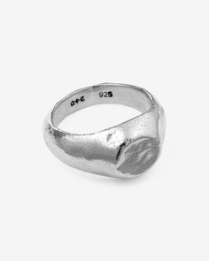 Energised with the resolve to uphold every pledge, the Oath Signet Ring safeguards all solemn commitments. Crafted from 925 Sterling Silver, this signet ring introduces a circular facade that gracefully melds into its thick body, and features a polished, yet time-worn, hand-hewn texture. This demi-fine piece is a versatile addition to any jewelry collection, suitable for all genders and expressions. Perfect for easy, everyday styling on its own or as a complement to any ring stack. Sold individu Symbolic Round Hand Cast Signet Ring, Sterling Silver Signet Ring With Ring Detail, Symbolic Sterling Silver Signet Ring For Promise, Oval Silver Signet Ring For Promise, Classic Sterling Silver Hand Cast Rings, Classic Hand Cast Sterling Silver Rings, Vintage Silver Signet Ring For Promise, Timeless Silver Signet Ring For Promise, Adjustable Sterling Silver Signet Ring For Promise