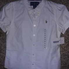 New With Tag Ralph Lauren Girls Short Sleeve Shirt. Button-Down. White. Size 5 Cute White Button Shirt, Cute White Button-up Shirt, Fitted Cute Ralph Lauren Tops, Cute Fitted Ralph Lauren Tops, Cute Ralph Lauren Summer Tops, Cute Summer Tops By Ralph Lauren, Cotton School Top With Buttons, Ralph Lauren Short Sleeve Spring Shirt, School Button-up Cotton Tops