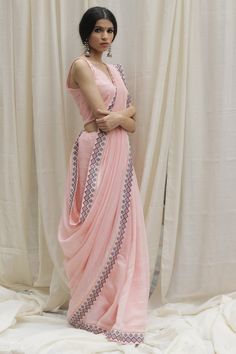 Editor's Note Featuring a baby pink aztec border saree beautifully used aztec embroidery border on this handwoven soft chanderi saree with unstitched blouse.. Color: Baby Pink Fabric: Chanderi Care: Dry Clean Only Customize Your Outfit Can't find the size you're looking for? No stress. Just select the size "Custom" while adding the item to your cart. We will follow up with you for your body measurements. To request a color or design customizations, please contact our customer care by using our " Baby Pink Saree, Floral Print Saree, Aztec Embroidery, Embroidery Border, Floral Print Sarees, Chanderi Saree, Border Saree, Saree For Women, Print Saree