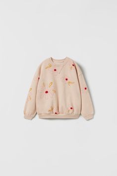 FLORAL SWEATSHIRT - Faded pink | ZARA United States Cute Cream Outerwear, Cute Cream Long Sleeve Outerwear, Beige Long Sleeve Sweater With Floral Embroidery, Cute Long Sleeve Spring Sweatshirt, Embroidered Long Sleeve Beige Sweater, Beige Embroidered Long Sleeve Sweater, Beige Crew Neck Outerwear For Spring, White Ribbed Collar Outerwear For Spring, Long Sleeve Sweatshirt With Ribbed Cuffs For Spring