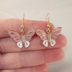 These Beautiful Pink Rhinestone Crystal Butterfly Earrings Are Gold Plated, Hand Oil Painted, And Are On Hypoallergenic Hooks That Will Not Hurt Your Ears. Brand New, Handmade, And Never Been Worn. Lead And Nickel Free. Rubber Backs Included. These Fine Quality Earring Are Perfect For All Day, Everyday Wear Or A Special Gift. Get An $18 Gift Of Your Choice In My Listings With Purchase Of Two Or More Items. Please Send Offers And Questions. Charms: 26x20mm Or 1.02" X.78" Pink Butterfly Charm Earrings, Pink Hypoallergenic Jewelry For Parties, Pink Hypoallergenic Party Jewelry, Pink Butterfly Charm Drop Earrings, Pink Butterfly Charm Dangle Jewelry, Pink Dangle Jewelry With Butterfly Charm, Pink Metal Jewelry With Butterfly Charm, Pink Drop Earrings With Butterfly Charm, Dainty Pink Hypoallergenic Jewelry