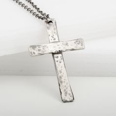 Capture the perfect balance of vintage style and meaningful symbolism with this handmade Cross Tradition pendant necklace in sterling silver. With it's hand hammered patina and traditional look, this cross necklace is a beautiful sentiment of faith, love, and family bonds. Great for gifting to friends or family, it's the perfect way to show that special someone your love. Hand Cast Cross Necklaces For Gifts, Hand Cast Cross Necklaces As Gifts, Hand Cast Cross Necklace For Gifts, Hand Cast Cross Necklace For A Gift, Spiritual Silver Cross Necklace With Oxidized Finish, Antique Silver Cross Necklace Spiritual Style, Hand Forged Silver Cross Pendant Necklace, Hand Forged Silver Cross Necklace, Spiritual Cross Necklace With Oxidized Finish