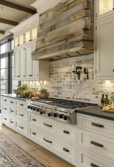 a kitchen with white cabinets and an oven