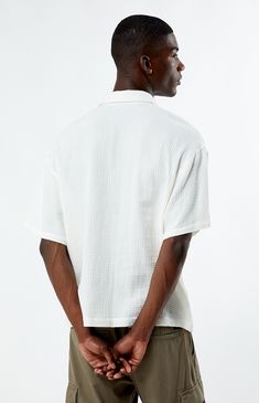 Whether you wear it for a special occasion or throw it on for a day at the skatepark, the Cream Boxy Button Down Shirt from PacSun is fashion-forward and can easily pair with the sick pieces in your closet. This button-down features a collared neckline, short sleeves, soft fabric, and a flattering fit. 


	Relaxed fit
	Short sleeves
	Collared neckline
	Button-down front closure
	PacSun branding
	100% Cotton
	Machine washable
	Model is wearing a size medium
	Model Measurements: 6'1”  Height, 34.5” Chest, 29" Waist Skate Park, The Cream, Model Measurements, Pacsun, Workout Shorts, Soft Fabric, Soft Fabrics, Button Downs, Fashion Forward