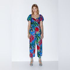 Zara Floral Print Jumpsuit Size: Xs New Without Tags! In Excellent Condition! Chic Multicolor Short Sleeve Jumpsuits And Rompers, Blue Printed V-neck Jumpsuits And Rompers, Spring Blue Tropical Print Jumpsuits And Rompers, Blue Floral Print Short Sleeve Jumpsuit, Multicolor V-neck Jumpsuits And Rompers With Tropical Print, Casual Tropical Print V-neck Jumpsuits And Rompers, Zara Casual Floral Print Jumpsuits And Rompers, Blue Tropical Print Jumpsuits And Rompers For Beach, Fitted Multicolor Tropical Print Jumpsuits And Rompers