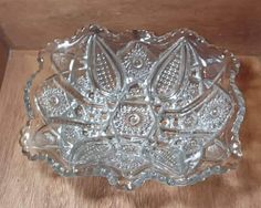 a glass bowl sitting on top of a wooden table