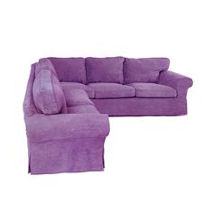 a purple couch and footstool sitting next to each other on a white background