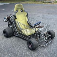 an empty shopping cart sitting in the middle of a parking lot