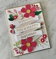 a handmade birthday card with flowers on it, and the words wishing you a happy birthday