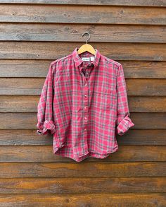 *Please read the entire description before purchasing!* Women's 90s vintage LL Bean plaid flannel shirt in fantastic condition. Soft and cozy for chilly fall days. Made in the USA and 100% cotton flannel. Red, green and white plaid. Sizing: Tag indicates women's large, please see measurements below. SPECIAL NOTES: *Red, white and green plaid *100% cotton flannel *Shirttail hem *Single front pockets *This item is in very good vintage condition with some subtle signs of wear *Color may vary with different screens *This item is machine washed and steamed by me before listing Measurements (buttoned): Bust/Chest (armpit to armpit): 23" Length (highest shoulder point to hem): 27.5" Waist (across the front): 22.5" Shoulder Width (shoulder seam to shoulder seam across back): 18" Care and Washing I Vintage Ll Bean, Grunge Vintage, Red Plaid Flannel, Fall Days, Button Up Top, Plaid Flannel Shirt, 90s Vintage, Green Plaid, Ll Bean