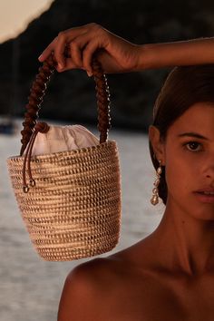 A luxe, take on the bag that started it all - our signature Lunchpail, now finished with an intricately hand-braided Napa Leather handle, from a centuries old Italian atelier, heralded for it’s world class quality and attention to details. Cesta baskets are handwoven by female artisans in Rwanda, Africa, using locally sourced, renewable resources. Each piece is hand finished in Italy with carefully chosen, sustainable materials. This basket took a master craftswoman over 6 days to weave. 6" W x French Riviera Style, Rwanda Africa, Lunch Pail, Boho Bags, Jane Birkin, Gender Equality, Social Impact, Beach Photoshoot, Basket Bag