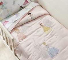 there is a bed with princess sheets on it