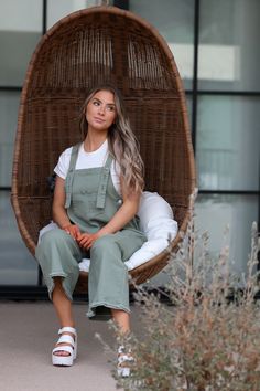 Introducing the Frankie Denim Overalls in Sage. Designed with adjustable straps, an oversized fit, and distressed details, these sage green bib overalls offer both style and comfort. The wide leg pant gives a trendy touch, making them a must-have for any fashion-forward individual. Model Measurements: Hips 40.5” Waist 27.5” Bust: 34”, Height 5’7.5, wearing a size small Material: 100 Cotton Measurements XS: Hips: 42"| Length: 44" (taken from top of front of overalls to ankle cuff) S: Hips: 42"| L Casual Olive Jumpsuits And Rompers For Spring, Green Relaxed Fit Overalls For Spring, Green Relaxed Fit Overalls, Spring Green Relaxed Fit Overalls, Casual Green Jumpsuits And Rompers With Suspenders, Trendy Green Overalls With Pockets, Green Overalls For Fall, Spring Green Overalls With Suspenders, Green Fall Overalls