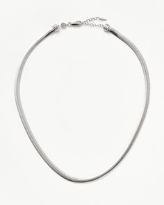 The starting point for all your layering looks. Ace your base with this silver vintage-inspired necklace, easily mixed and matched with other pieces. Layer with a chunky t-bar chain or a delicate choker to make an impact.Metal: Rhodium Plated on Recycled Sterling SilverLength: 450mm with continuous extension from 410mm to 450mmDimensions: 4.49mmWeight: 17.3gProduct Code: CR-S-N6-NS Flat Snake Chain, Delicate Choker, Mens Diamond Bracelet, Trending Bracelets, Snake Chain Necklace, Coin Pendant Necklace, Earring Trends, Inspired Necklace, Engraved Bracelet