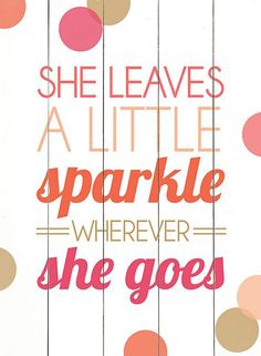 a white framed poster with polka dots on it that says she leaves a little sparkle wherever she goes