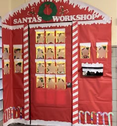 a santa's workshop door is decorated with red and white paper