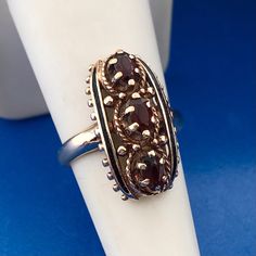 Art Deco Art Nouveau 10K Yellow Gold Oval Garnet January Anniversary Finger Ring Ring size: 6.50 Top of ring measures: 7/8" x 3/8" Garnets measure: approximately 6.0 mm x 3.0 mm each Ring Weight: 4.9 tgw Markings: 10K * AJ   Condition: As pictured, in great condition. G1545 5% Restocking Fee Antique Oval Three Stone Rings, Antique Three Stone Oval Jewelry, Antique Oval Three-stone Jewelry, Antique Three-stone Oval Jewelry, Antique Oval Hallmarked Ring, Elegant Oval Cabochon Cluster Ring, Elegant Oval Cluster Ring With Cabochon, Victorian 14k Gold Oval Cluster Ring, Victorian Cluster Ring In 14k Gold, Oval Shaped