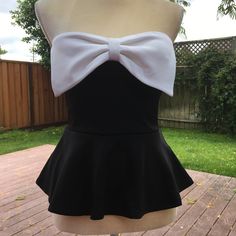 A Little Fancy And A Lot Of Comfy. Dress It Up Or Down Depending On The Occasion. Slightly Padded Bust. Nwt Color: Black, Ivory Size: S, M Measurements: S: Bust: 29”- 32” Waist: 25”- 28” Length: Cf/15” Cb/13” M: Bust: 31”- 34” Waist: 27”- 30” Length: Cf/15.5” Cb/13.5” 5-088,-089 White Strapless Top For Party, Chic Strapless Tops With Bow, Summer White Blouse With Bow Detail, White Summer Blouse With Bow Detail, White Bow Blouse For Summer, Summer White Blouse With Bow, White Summer Blouse With Bow, Fitted White Blouse With Bow, Chic Fitted Strapless Blouse