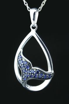 Elegant Whale / Dolphin Tail Pendant with stunning London Blue Topaz in Sparkling Sterling Silver (925) Total Weight: 1.80grams (not including Chain (925 Sterling Silver, 18 inches) Dimensions: (HXW): 27.38mm X 13.78mm Ceylon Created Sapphire: (3) 1.5mm Cut: Round Ceylon Created Sapphire (13): 1.25mm Cut: Round Chain: Comes with a lovely 925 Sterling Silver Box Chain, 18 inches (Chain Not Shown In Photo) Precious Metal: 925 Sterling Silver Style Number: S38S17442-LCSA SKU: 550-10277 Silver Tanzanite Necklace With Diamond Accents, Silver Tanzanite Jewelry With Diamond Accents, White Gold Jewelry With Polished Blue Topaz, Silver Tanzanite Teardrop Jewelry, Silver Sapphire Necklace With Accent Stones, Sapphire Jewelry With Gemstone Accents In Sterling Silver, Fine Jewelry Blue Topaz With Polished Finish, Sapphire Pendant With Accent Stones, Teardrop Blue Topaz White Gold Jewelry