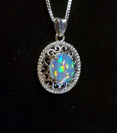 Stunning Natural Rainbow Opal Necklace, 8x10mm Ethiopian Opal With True Rainbow Fire, See Video! 925 Sterling Silver Filigree Pendant With Cubic Zirconia Halo, Rhodium Plated, 18" Sterling Silver Chain. Velvet Necklace Box Included. Great Gift! Velvet Necklace, Rainbow Opal, Rainbow Fire, Filigree Pendant, Sterling Silver Filigree, Natural Rainbow, Necklace Box, Silver Filigree, Opal Necklace