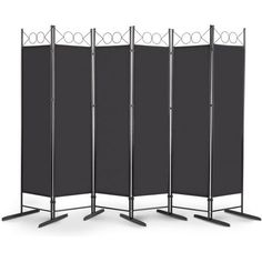 four - panel room divider with black fabric panels and metal poles on each side