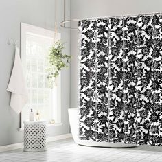 a black and white shower curtain in a bathroom