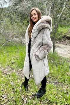 WOMEN’S DESERT WARRIOR COAT FEATURES High quality faux fur. Lined with super soft cuddle minky fabric. Over sized fur lined hood and large lapel. 2 Deep zipper pockets on the inside front sides (large enough for a water bottle). 2 Outside pockets to keep your hands warm. 6" Invisible zipper ID "secret" pocket on the inside left chest lining. 3 Outside button closures. Inside back pack straps to wear the coat like a cape when you are hot. Length is shorter in the back around the knee, longer in t Desert Warrior, Punchy Outfits, Fur Hooded Coat, Faux Fur Hooded Coat, Chinchilla Fur, Secret Pocket, Army Women, Long Coat Women, Winter Mode